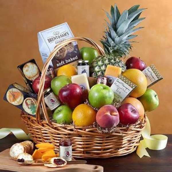 Large gourmet fruit and snack basket with apples, citrus, pineapple, cheese, and cookies