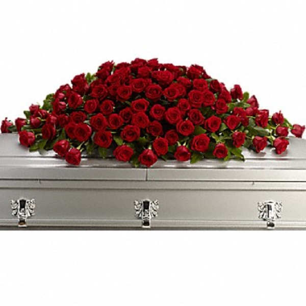 Red rose casket spray on a silver casket