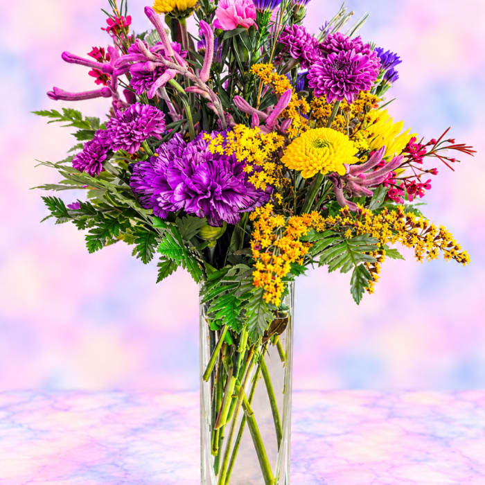 Colorful mixed bouquet in a clear glass vase