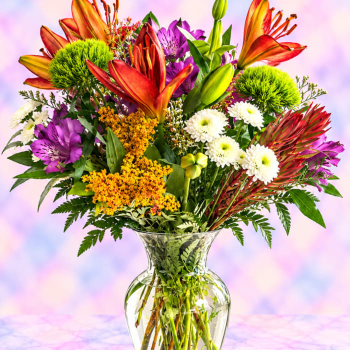 Colorful mixed bouquet in a clear glass vase