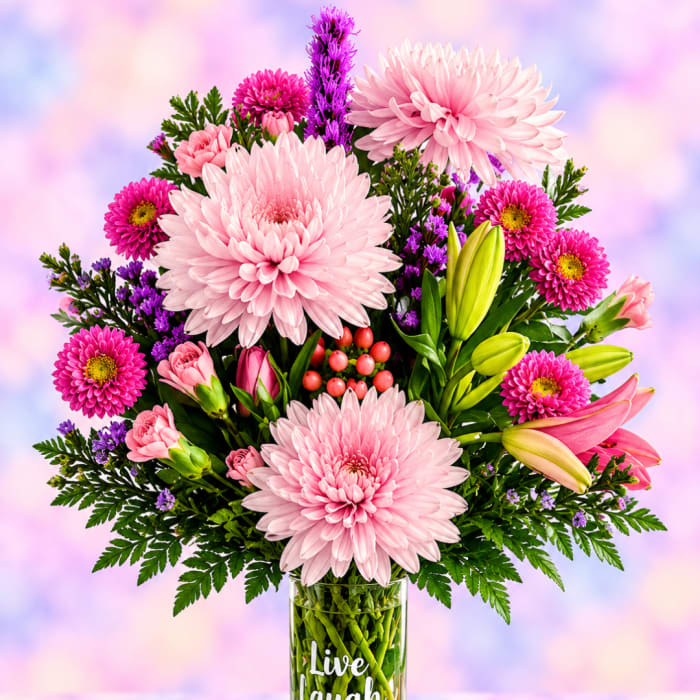 Pink and purple mixed bouquet in a clear glass vase