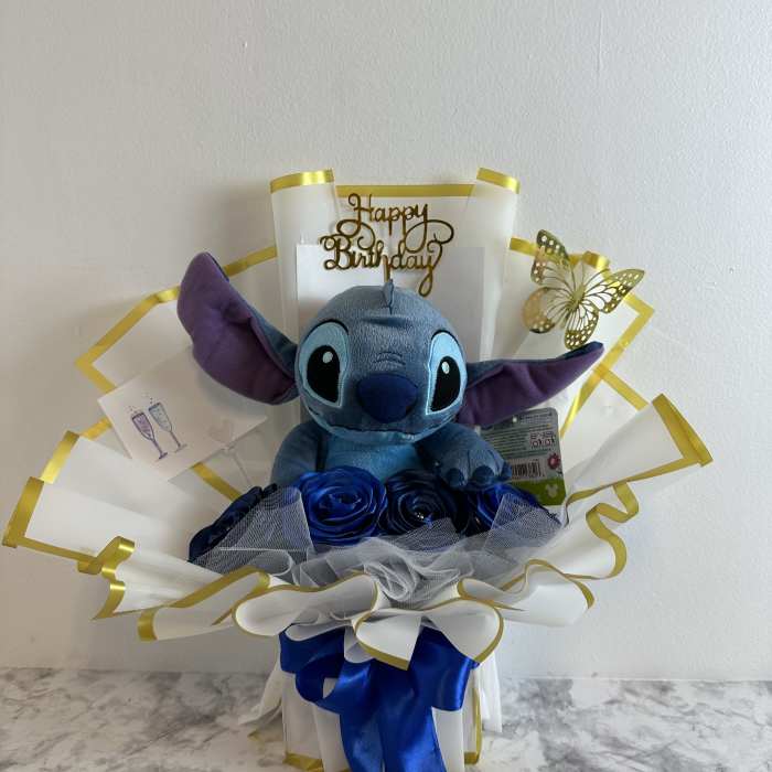 Blue plush Stitch gift bouquet with a Happy Birthday topper