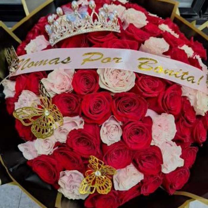 Bouquet of red and white roses with a crown and ribbon