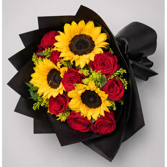 Bouquet of red roses and yellow sunflowers wrapped in black paper