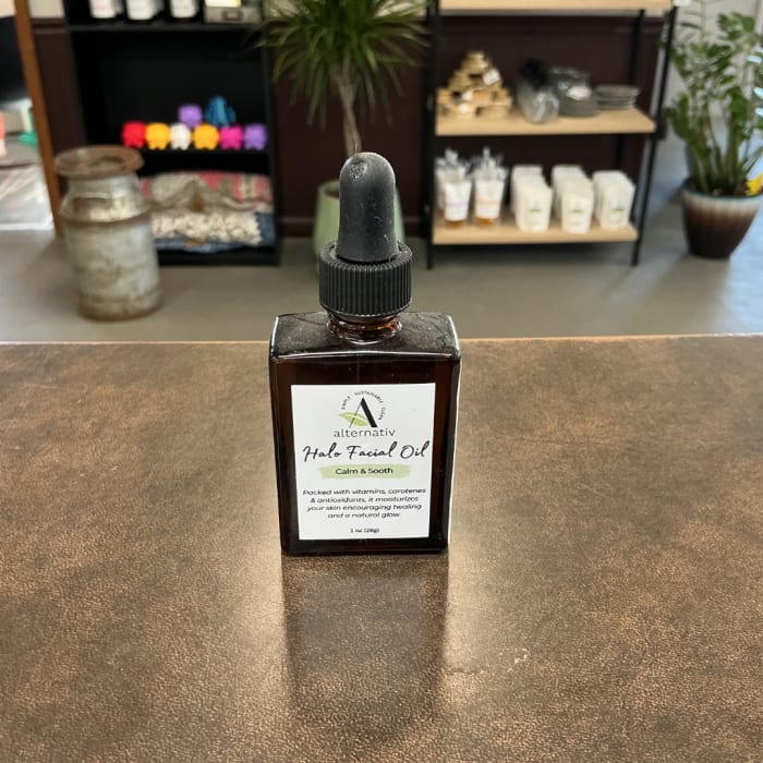 Amber dropper bottle of facial oil on a counter