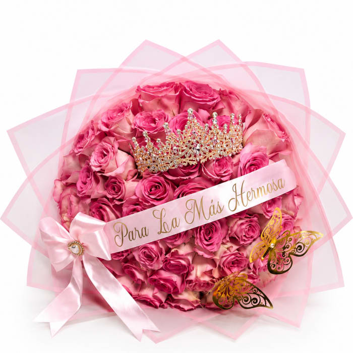 Pink rose bouquet with a jeweled crown and ribbon banner
