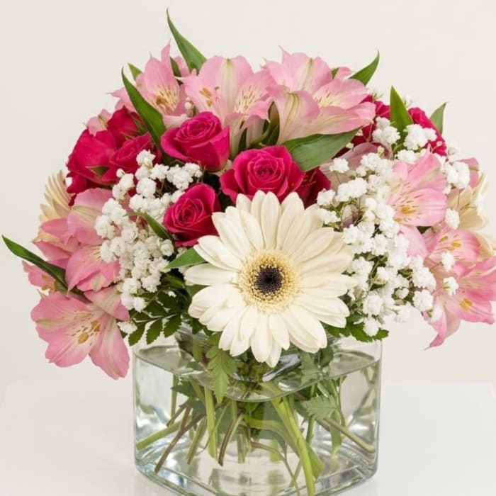 Pink and white mixed bouquet in a clear glass vase