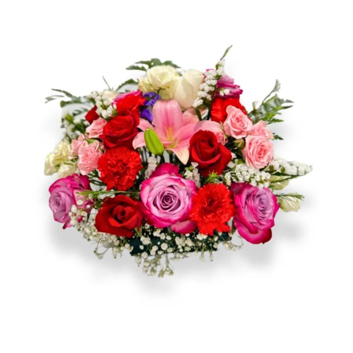 Mixed bouquet of roses, lilies, and carnations in pink, red, and white