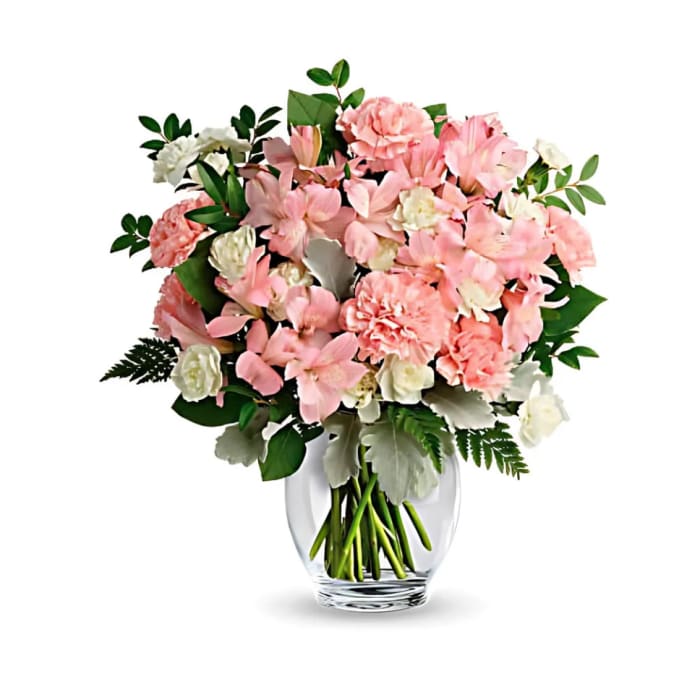 Pink and white mixed bouquet in a clear glass vase