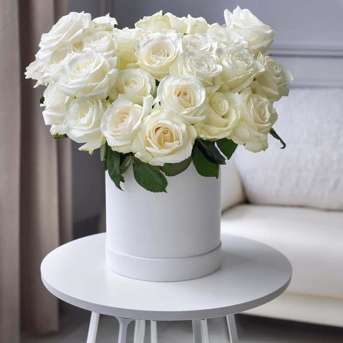 White rose bouquet in a white cylindrical box