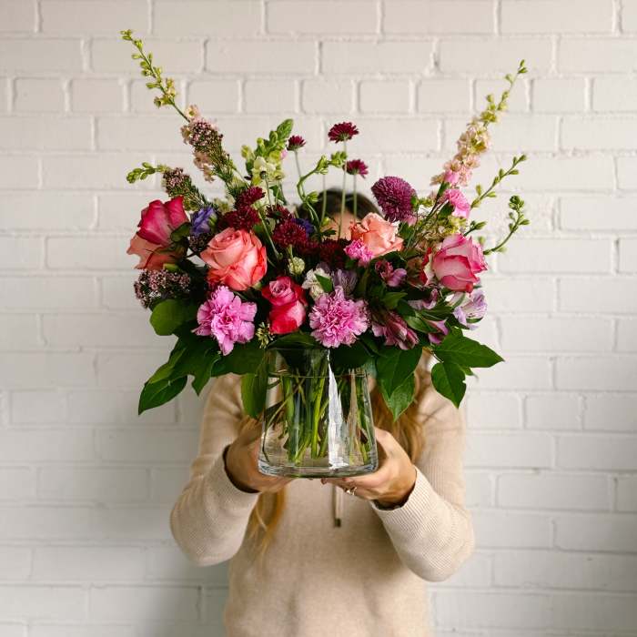 Mixed pink and purple bouquet in a clear glass vase