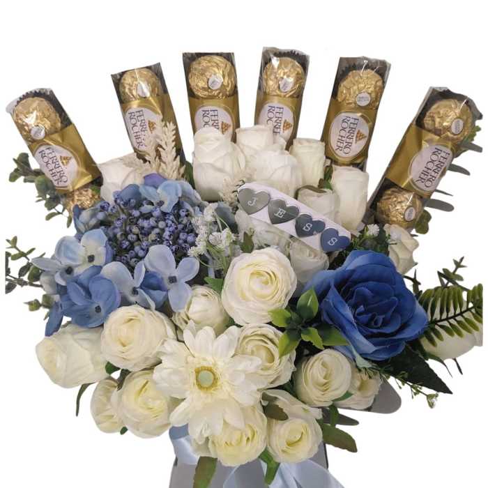 Bouquet of white and blue flowers with Ferrero Rocher chocolates