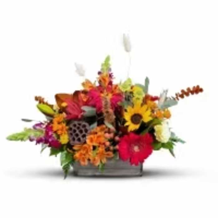 Colorful mixed flower arrangement in a low rectangular container