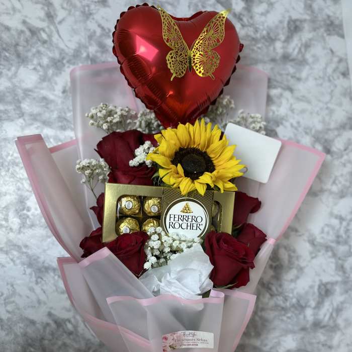 Bouquet of red roses with a sunflower, chocolate box, and heart balloon