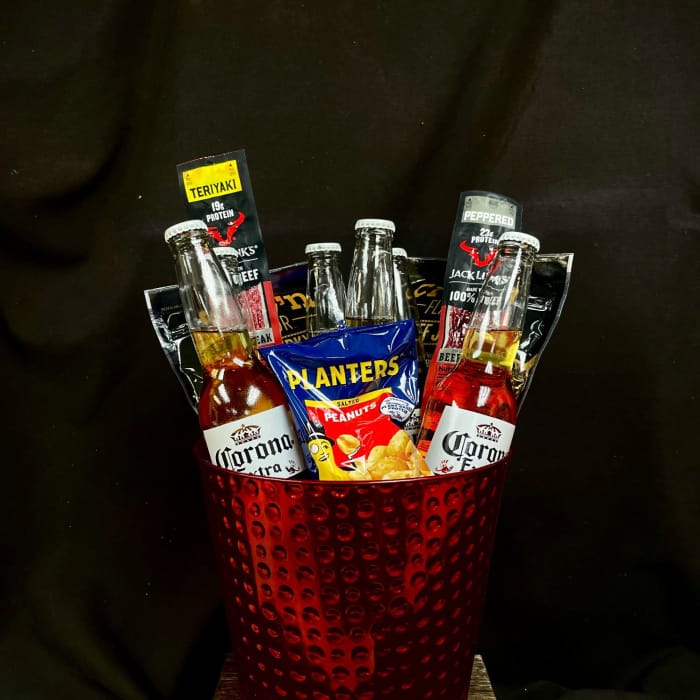 Gift bucket with beer bottles, jerky packs, and peanuts