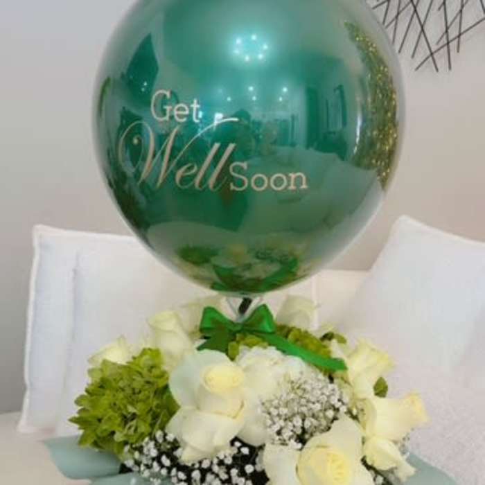 White roses and green hydrangea with a teal get well soon balloon