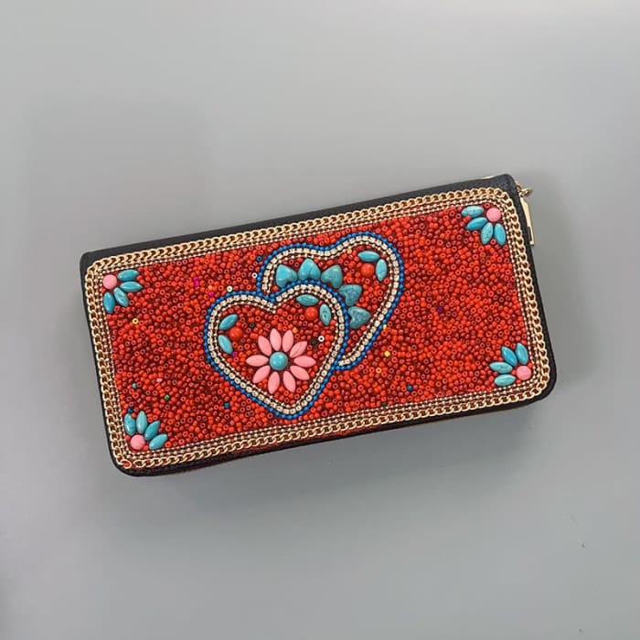 Beaded red clutch with heart and flower designs