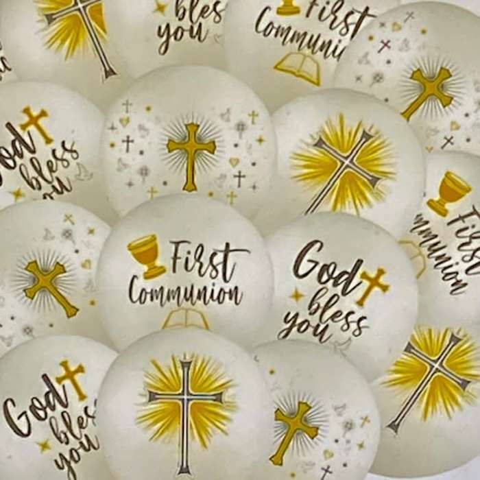 White communion balloons with gold cross designs and text