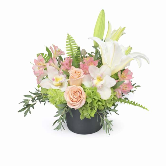 Pink roses and white lilies in a black vase