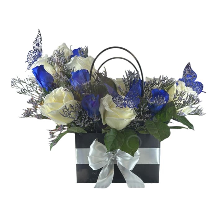 White and blue roses in a black gift bag with a silver bow