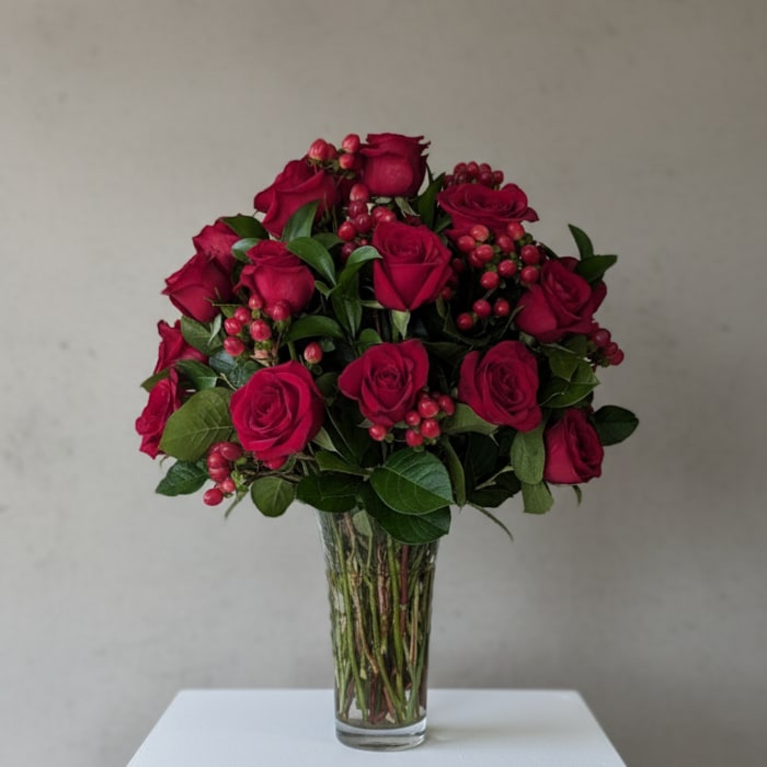 Bouquet of deep pink roses in a clear glass vase