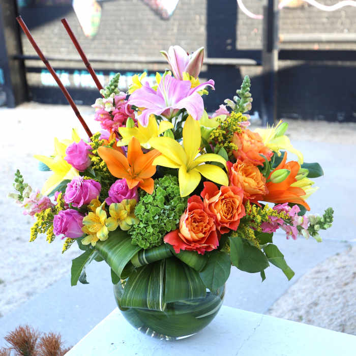 Colorful mixed flower arrangement in a glass vase
