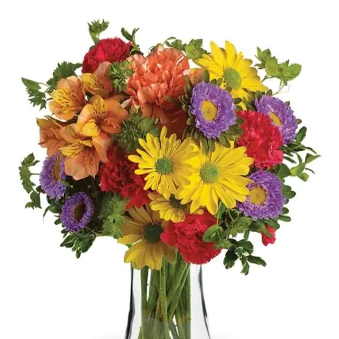 Colorful mixed bouquet in a clear glass vase