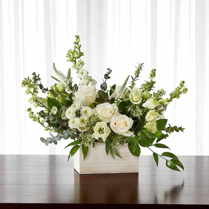 White floral arrangement in a rectangular white box