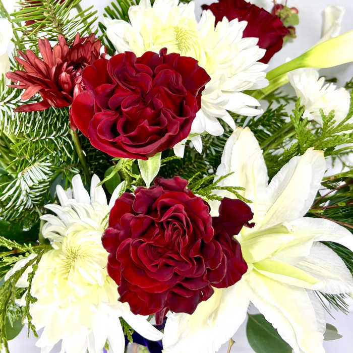 Bouquet of red roses and white lilies with white daisies