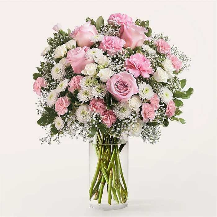 Pink and white mixed bouquet in a clear glass vase