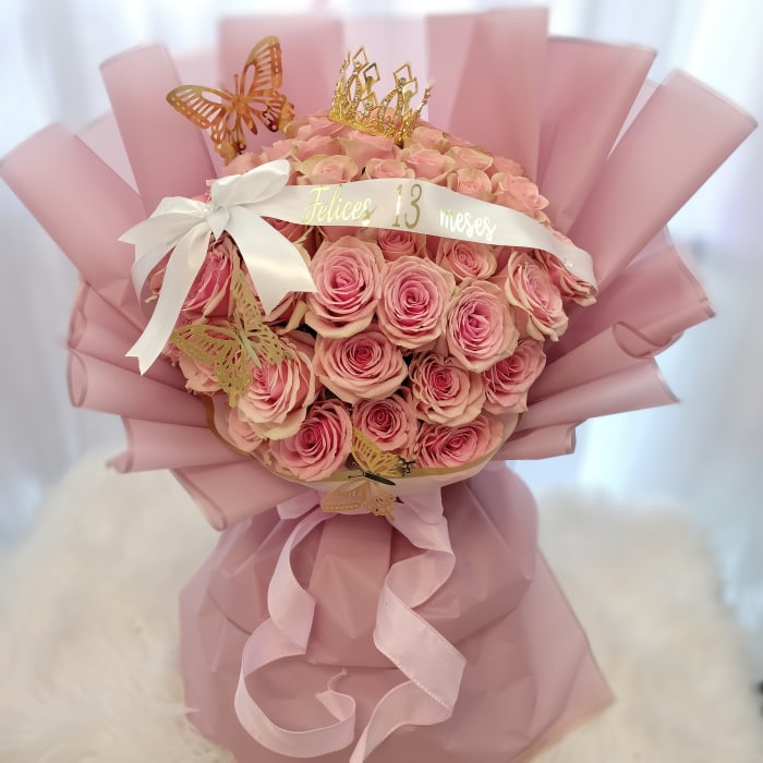 Pink rose bouquet with a crown and butterfly decorations