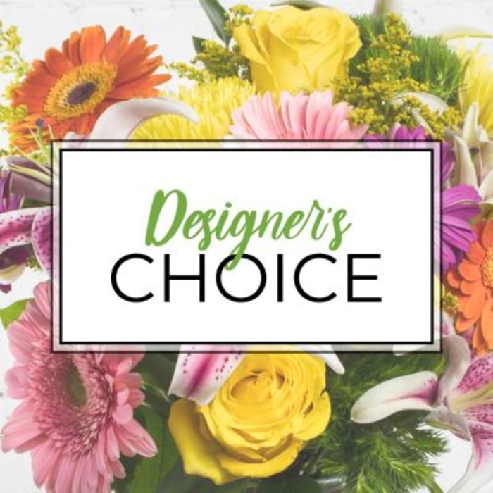 Colorful mixed flower arrangement with a "Designer’s Choice" sign