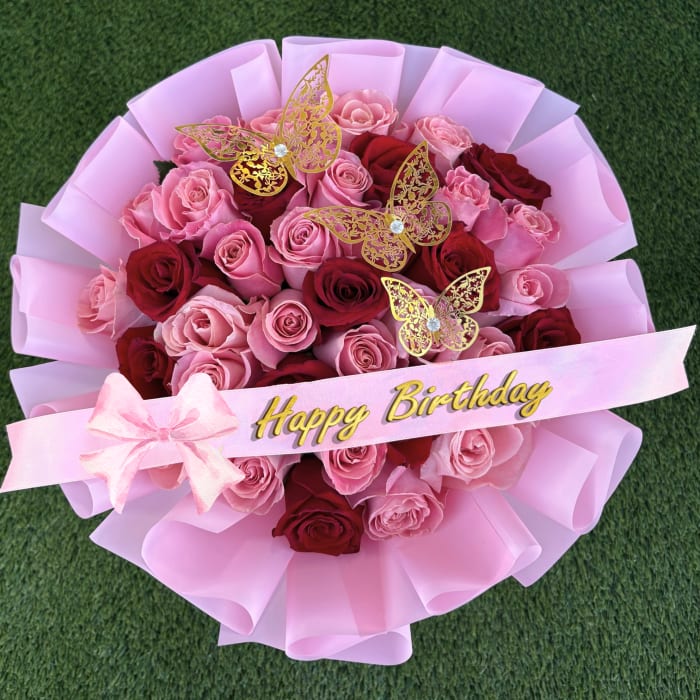 Pink and red rose bouquet with a Happy Birthday ribbon