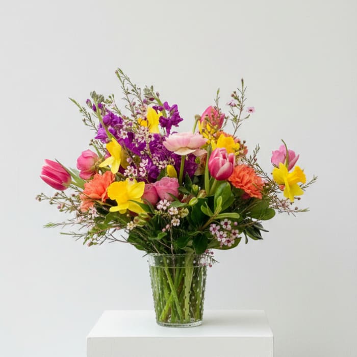 Colorful mixed bouquet in a clear glass vase