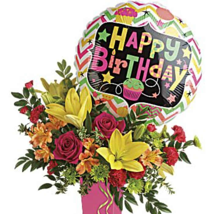 Birthday bouquet with a colorful balloon and mixed flowers in a pink vase