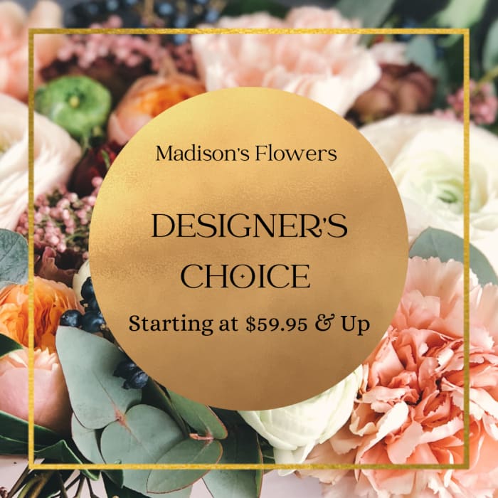 Designer’s choice floral arrangement with peach, white, and orange blooms