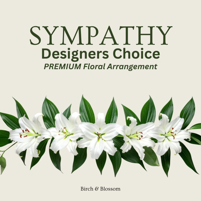 White lilies with green leaves and sympathy text