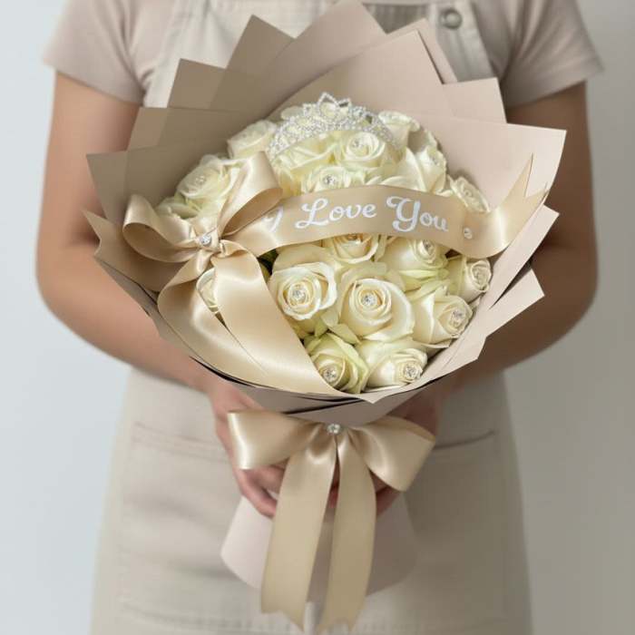 Cream rose bouquet with a satin ribbon and "Love You" banner