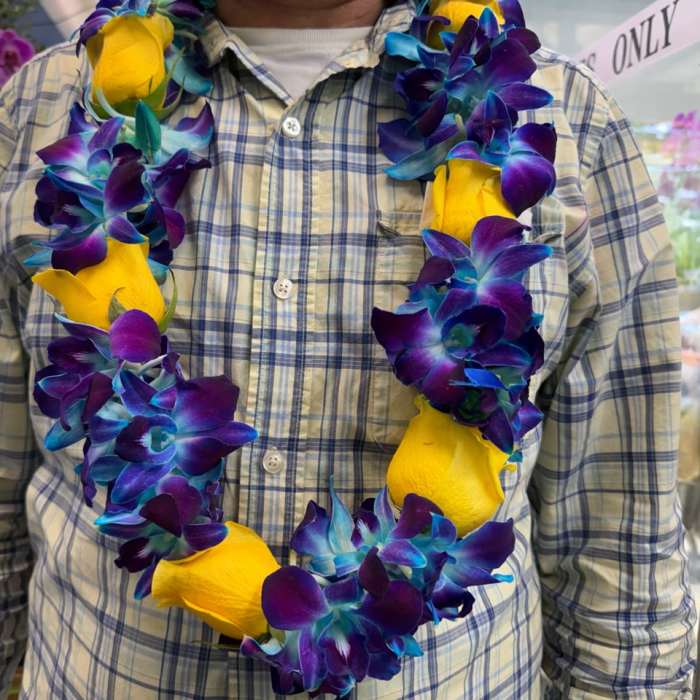 Blue orchid with yellow roses