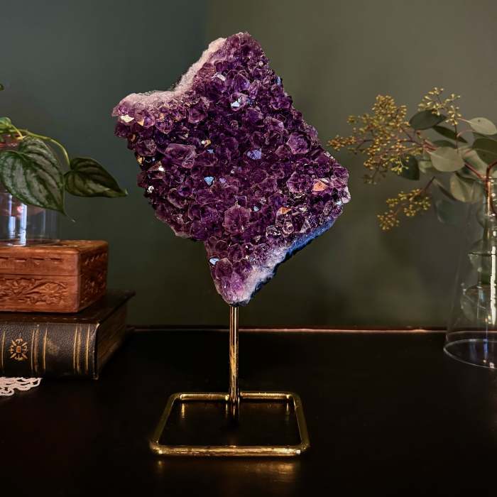 Purple crystal cluster on a gold stand
