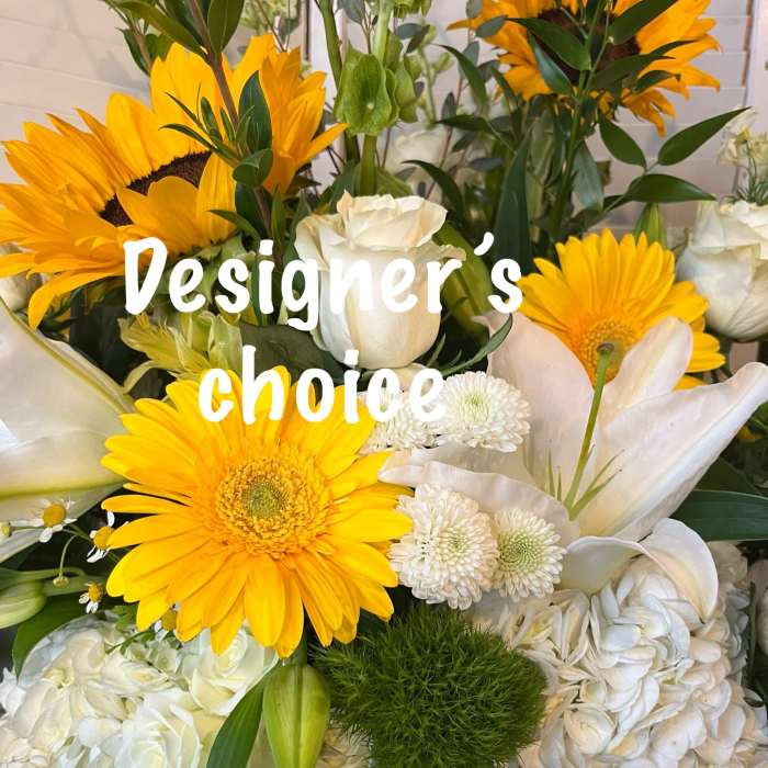 Bouquet of yellow gerbera daisies and white lilies with white blooms