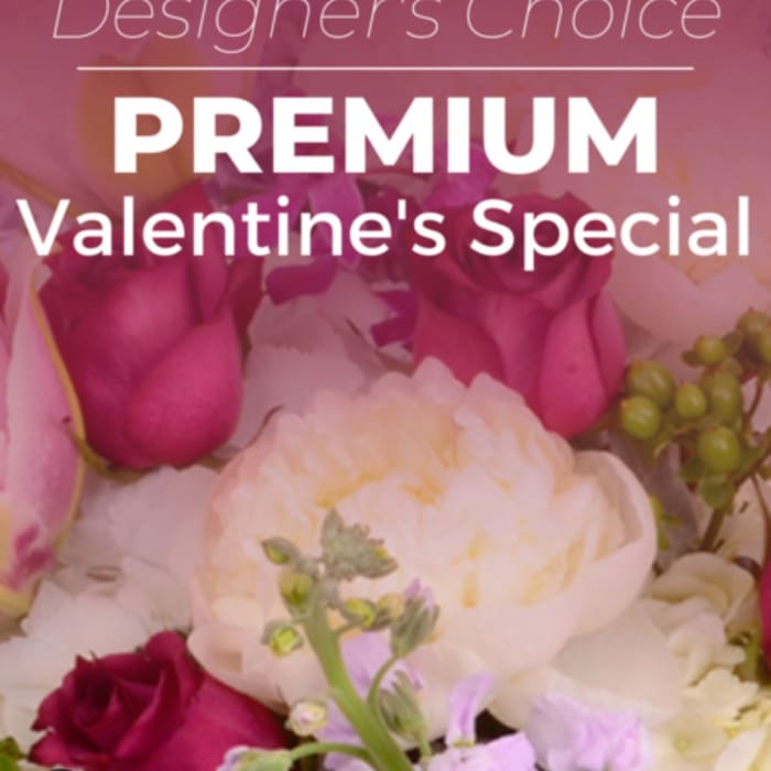 Pink and white floral arrangement with roses and peonies