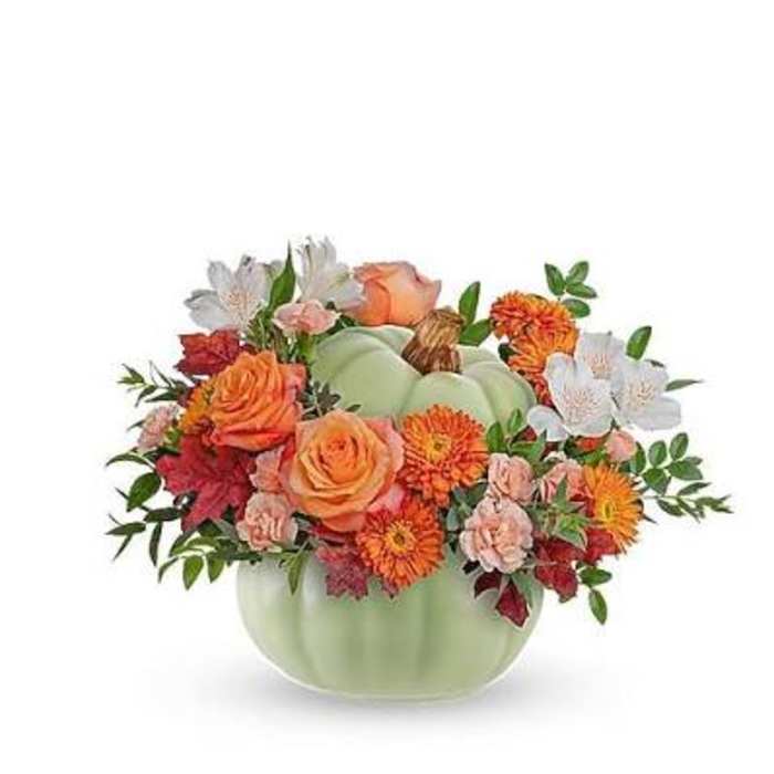 Pumpkin-shaped vase with orange and white flowers