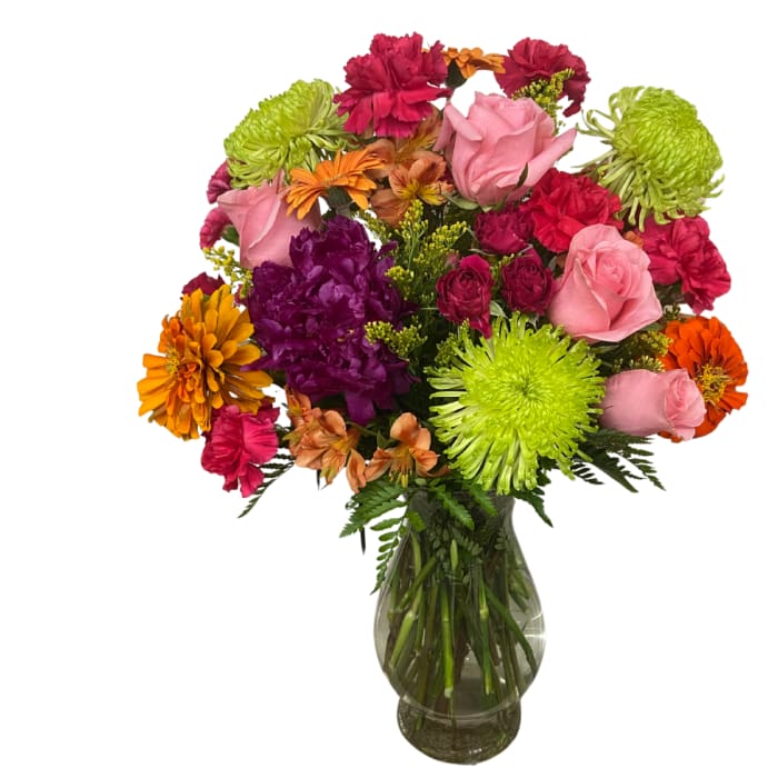 Mixed bouquet of roses and chrysanthemums in a glass vase