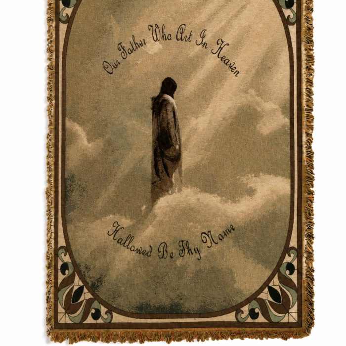 Fringed memorial tapestry with a figure standing in clouds and script text