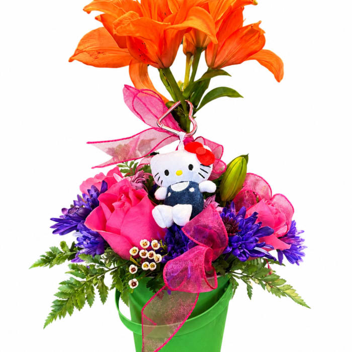 Orange lilies and pink roses with a Hello Kitty plush in a green bucket