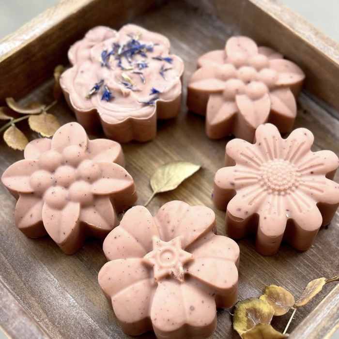 Tray of pink flower-shaped soaps with dried petals