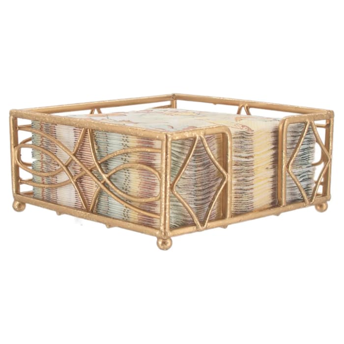 Decorative gold metal napkin holder with a stack of patterned napkins