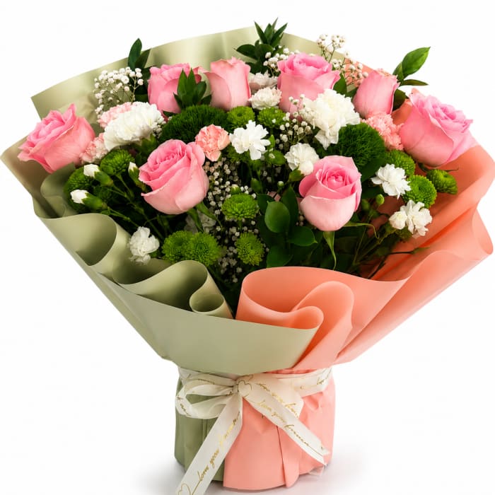 Bouquet of pink roses and white flowers wrapped in pastel paper