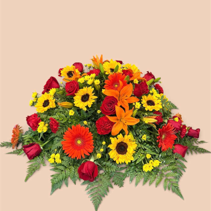 Bright mixed bouquet with red roses, orange lilies, and yellow daisies
